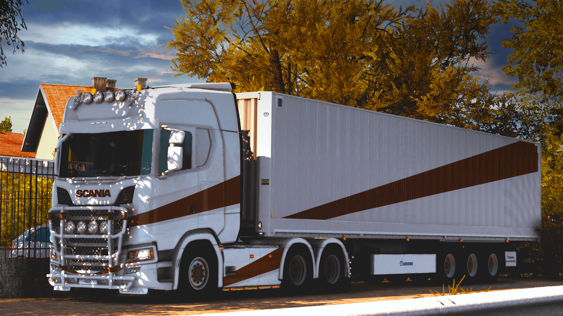 GPE truck parked on the side of the road in the autumn with orange trees all around, truck has the gold and white paint job